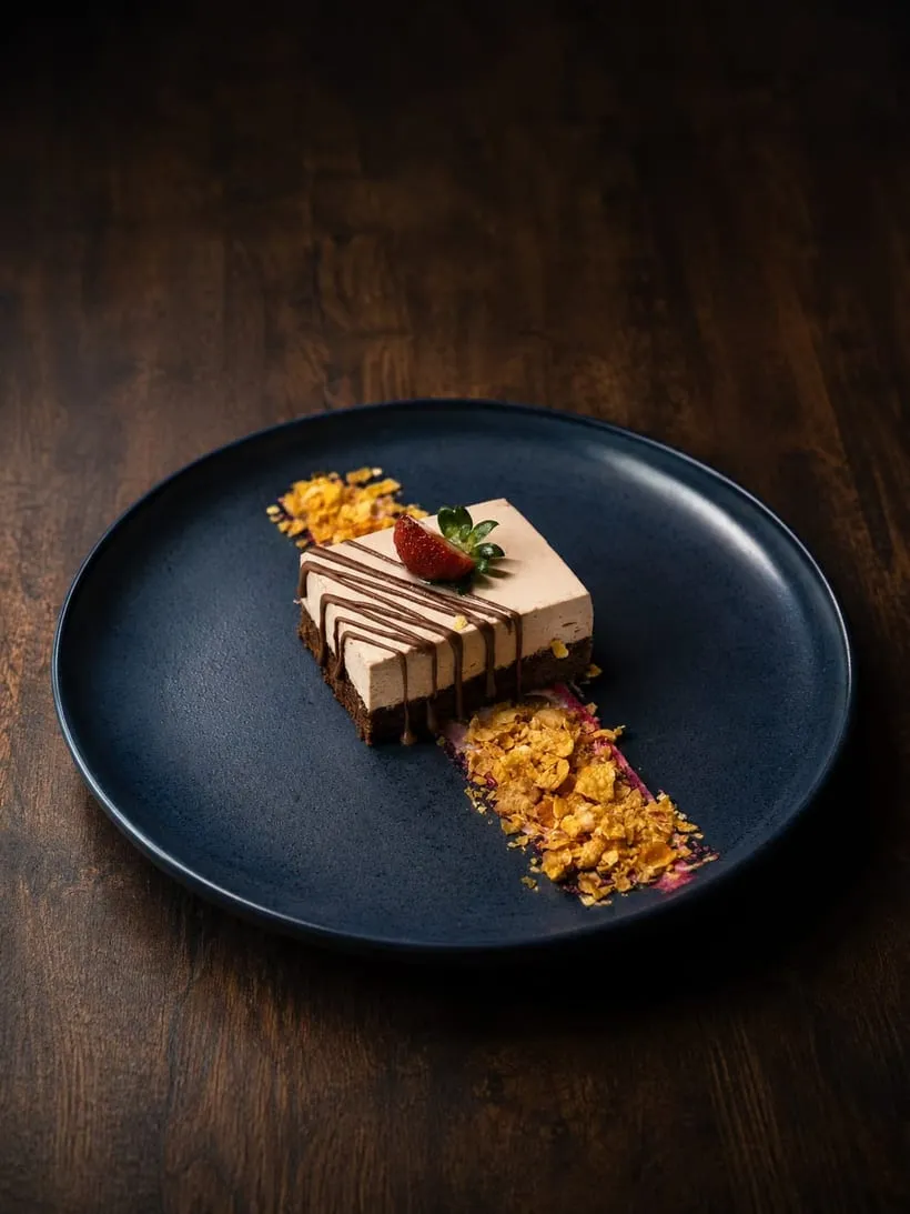 Chocolate cheesecake on a dark plate